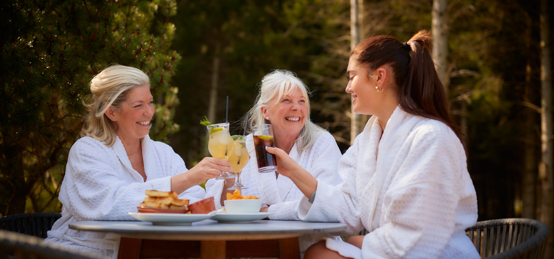 grandma, mum and daughter having lunch outside